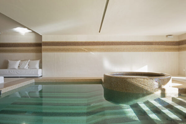 Indoor pool of private villa with lake view and bar area Indoor pool of private villa with lake view and bar area. Nobody inside
